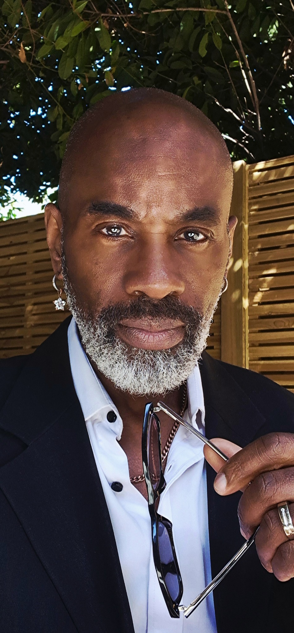 Heverton Reid wearing a tailored black blazer